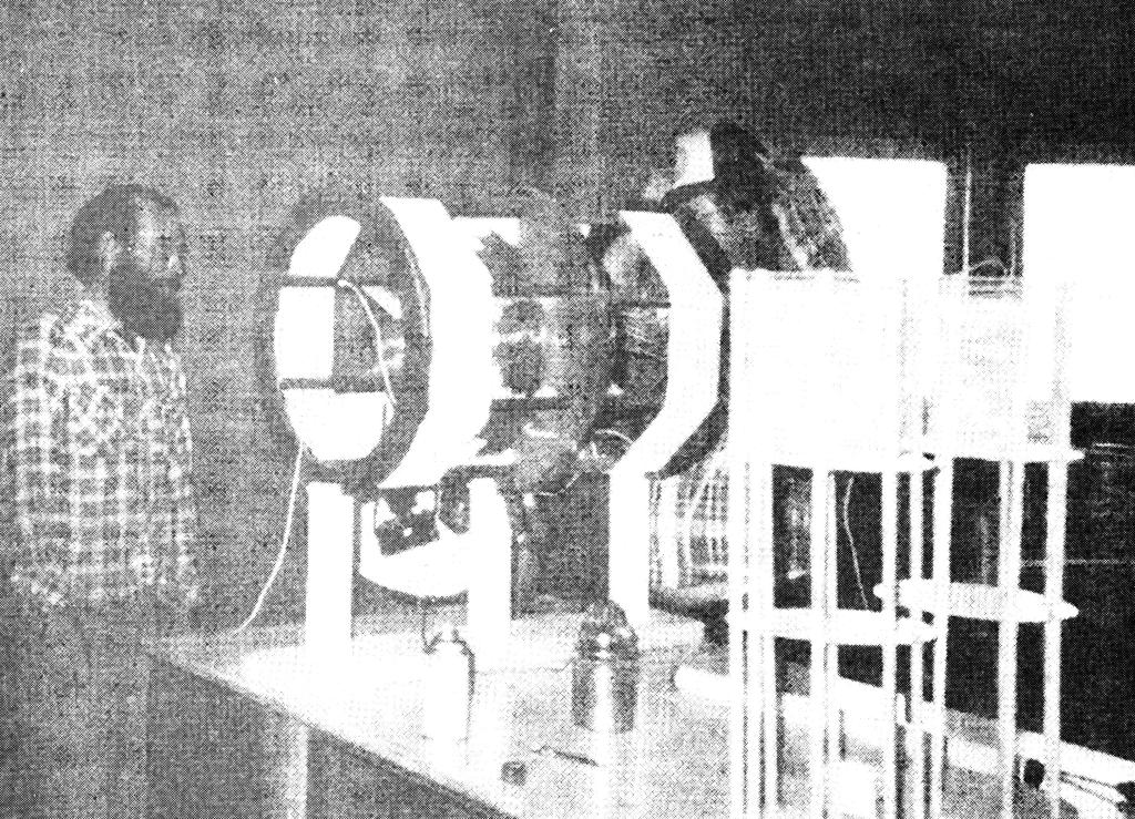 Eric Dollard next to cylindrical Tesla coil.