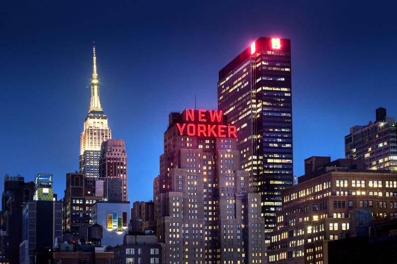 New Yorker Hotel building at night