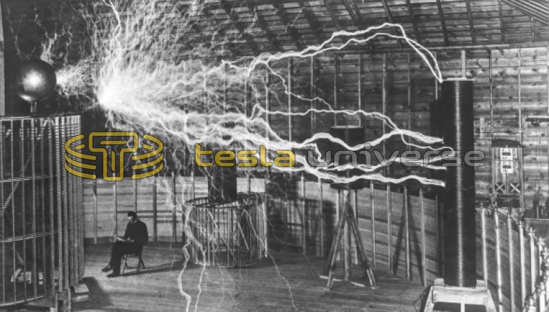 Nikola Tesla seated inside his Colorado Springs oscillator