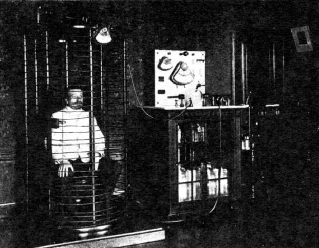 Patient in wire cage receiving high-voltage treatment