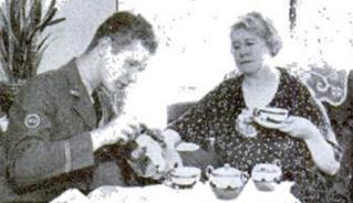 Telegraph messenger talking and reading to elderly person