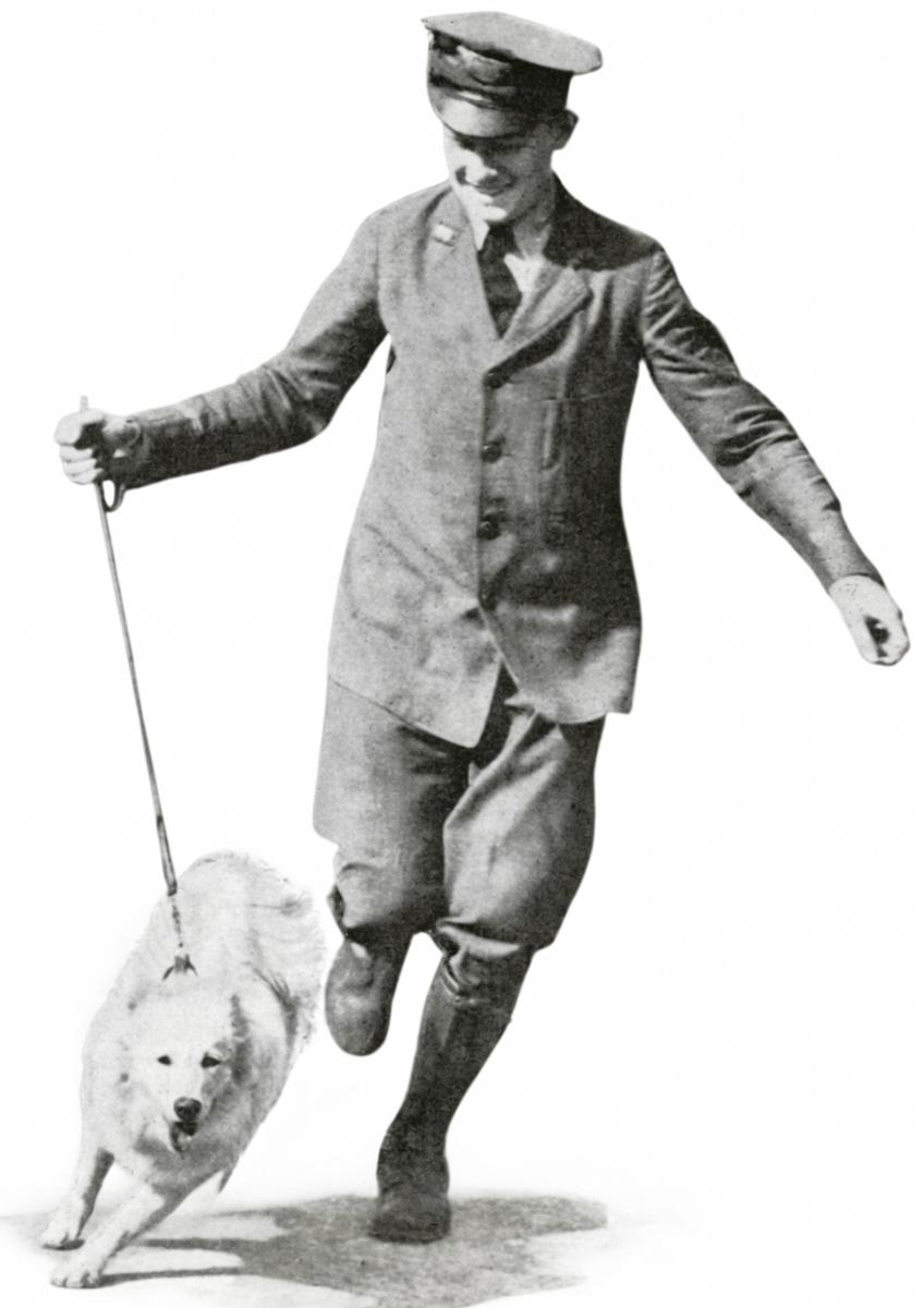 Telegraph boy walking dog