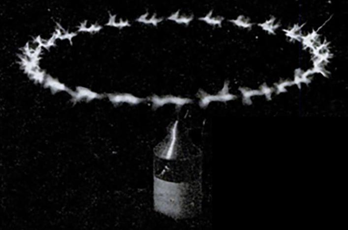 Electric pinwheel or ion motor powered by vacuum tube Tesla coil