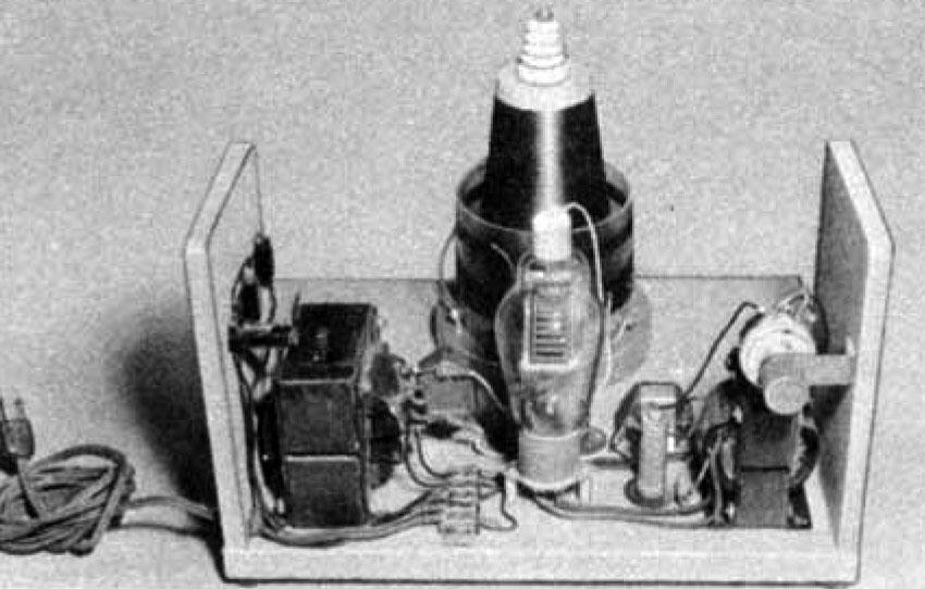 Tesla coil with cover removed to expose vacuum tube.