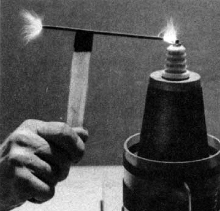 Tesla coil discharge passing through metal rod.