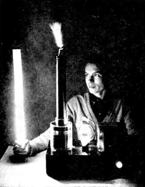 Fluorescent lamp held near coil from "New and Improved Tesla Coil" article by Strand