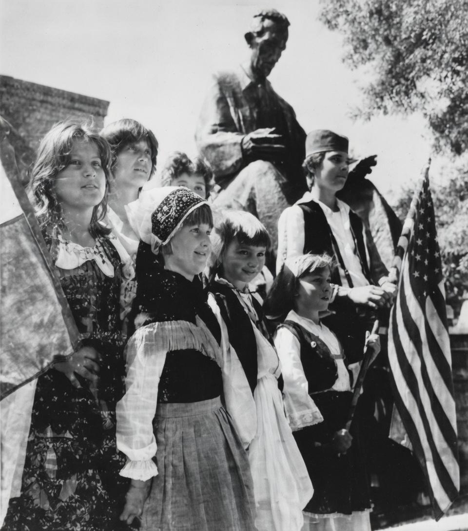 Children honor Tesla at the Goat Island statue