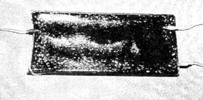 Voltage doubler sealed (potted) in candle wax.