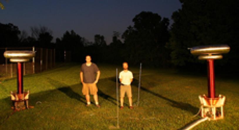 Steve Ward and Jeff Larson pose with their twin Tesla coils