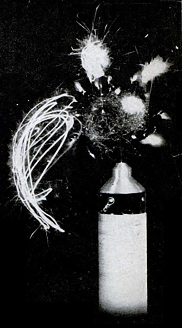 Steel wool sparking and burning from current induced by vacuum tube Tesla coil