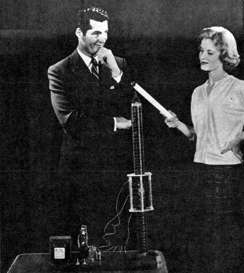 Couple experimenting with vacuum tube Tesla coil