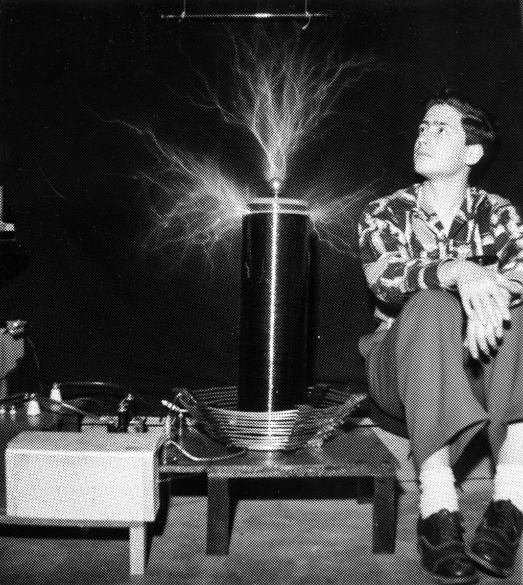 Eddy Aronson poses with his Tesla coil