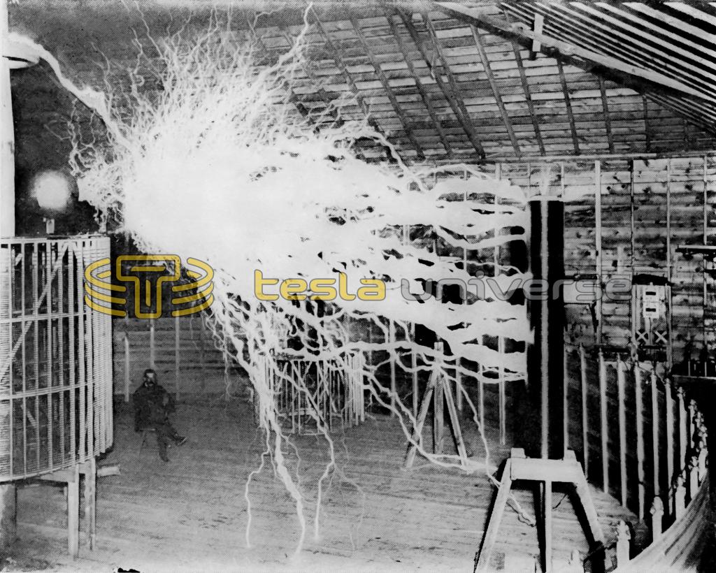 Tesla's assistant, Mr. Alley, sitting among massive streamers from the Colorado Springs oscillator