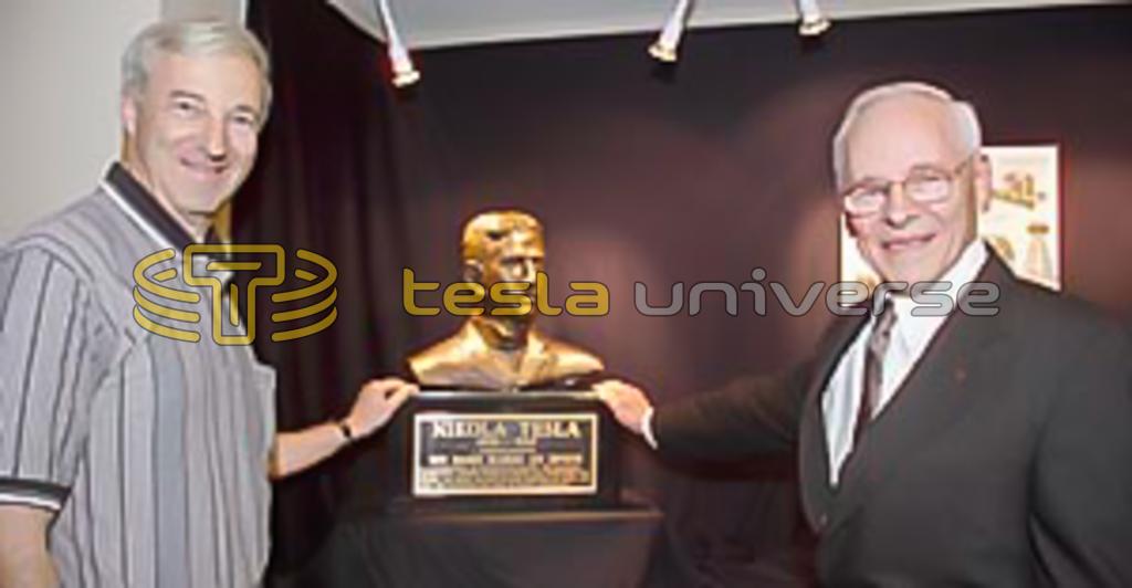 John Wagner presenting a Tesla bust to Cornell University