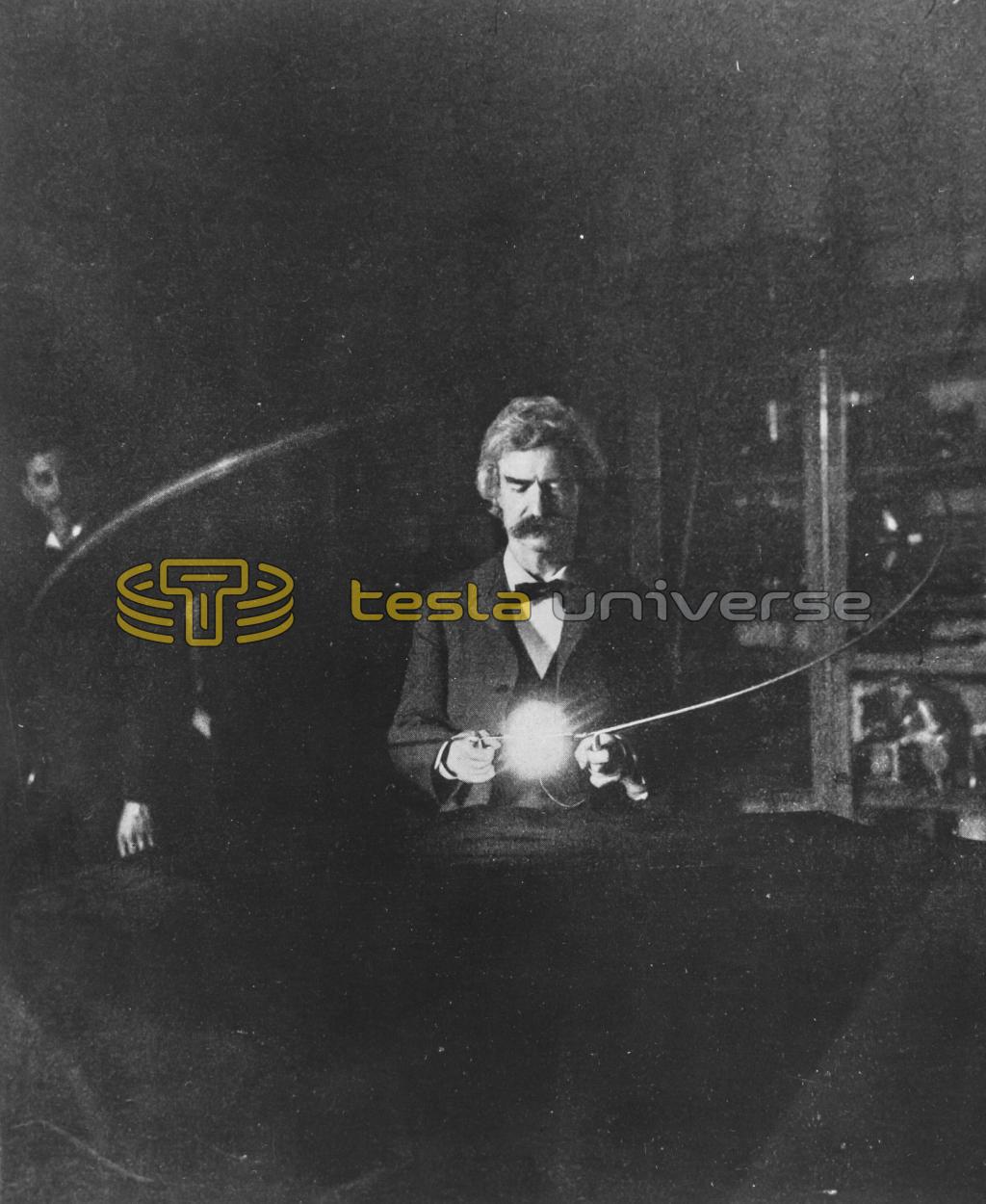 Mark Twain participating with experiment as Tesla watches from behind