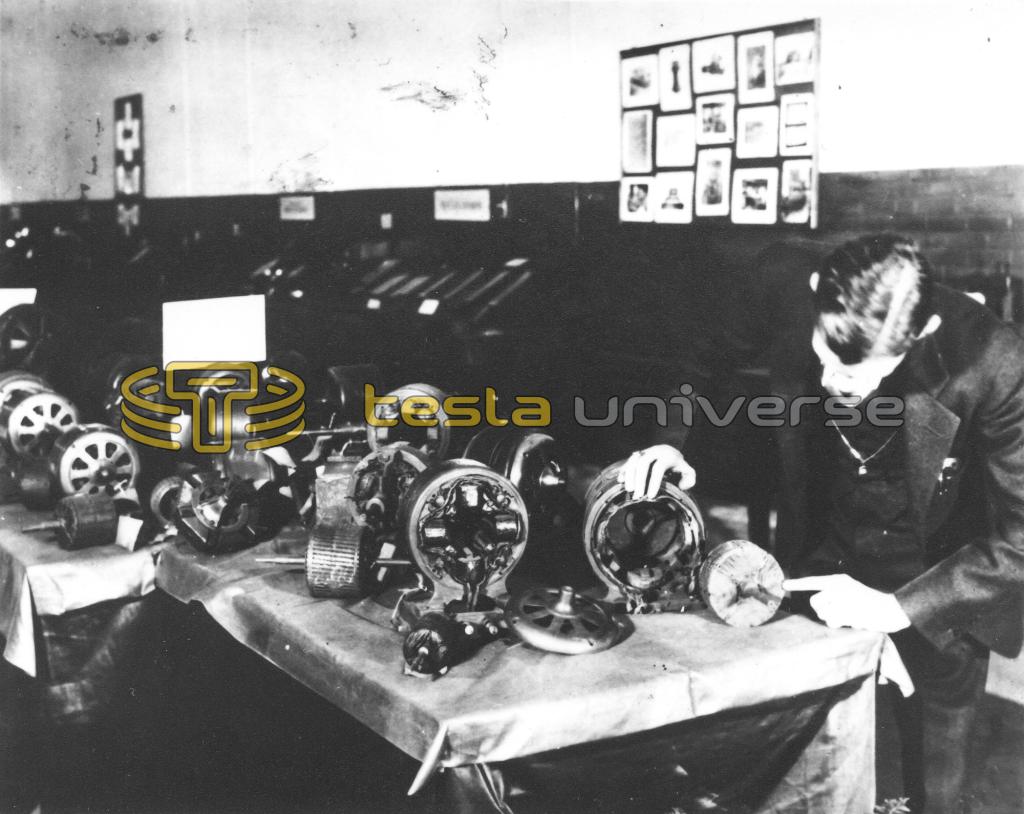 Nikola Tesla with some of his induction motors