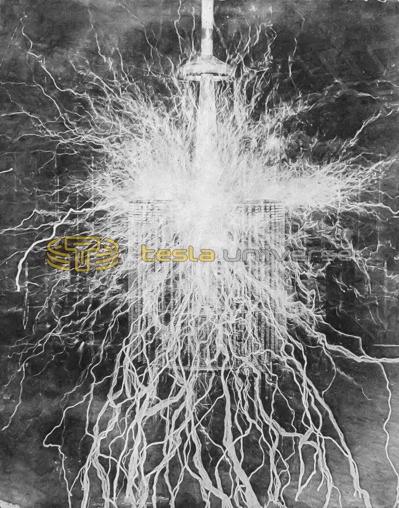 Tesla's Colorado Springs extra coil with streamers from a pointed wire pointed to camera