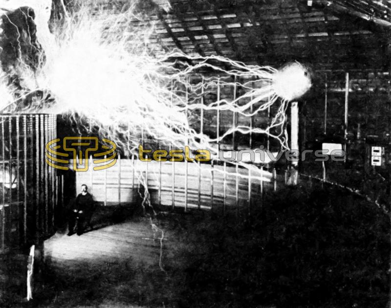 Mr. Alley, Tesla's assistant, poses in a test photo of the Colorado Springs oscillator