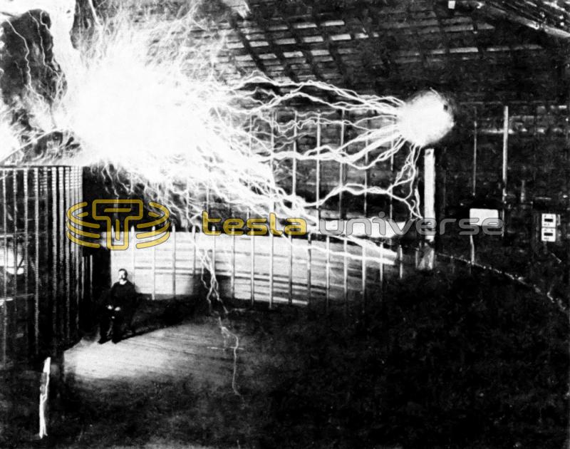 Mr. Alley, Tesla's assistant, poses in a test photo of the Colorado Springs oscillator