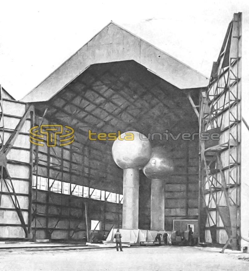 Huge Van de Graaff generator, shown housed in an aircraft hangar