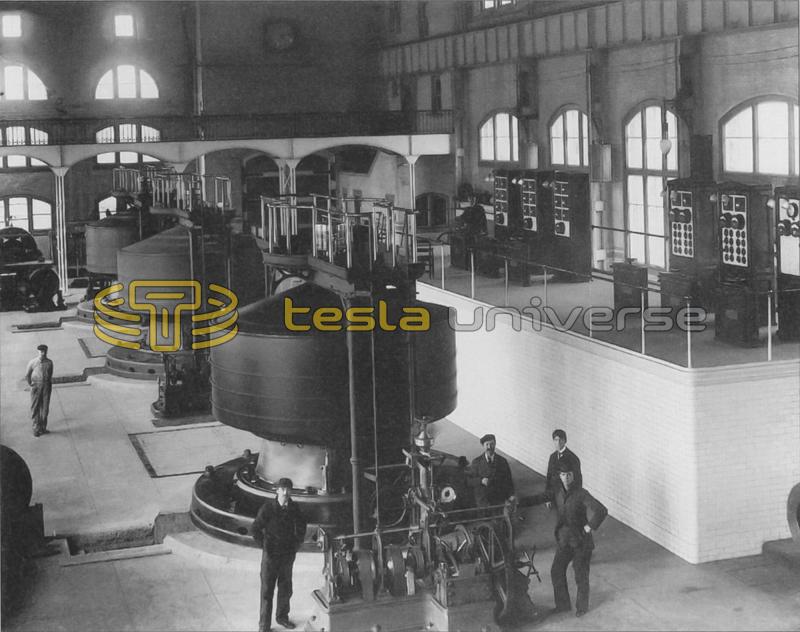 Workers pose near a Westinghouse-Tesla generator in the Edward Dean Adams power station