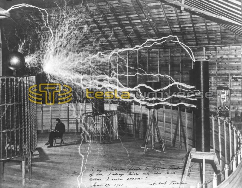 Nikola Tesla seated inside his Colorado Springs oscillator