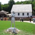 The Tesla monument with his birthplace in the background