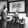 Tesla in his New York office in 1916, demonstrating an electrical apparatus
