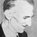 Nikola Tesla in his Later Years, Looks Down as He Smiles During Press Event