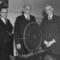 John T. Morris and Victor Beam pose with Nikola Tesla and his alternator