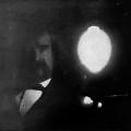 The face of Mark Twain illuminated by Tesla bulb