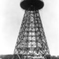 The Tesla Wardenclyffe tower with lab in background and car in foreground